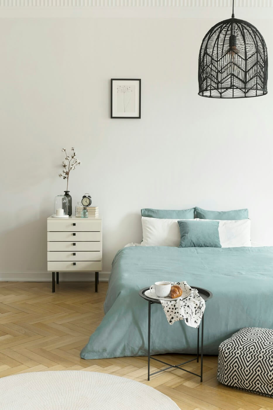 breakfast-on-a-metal-table-in-front-of-a-bed-with-sage-green-bed-U7JE6KD.jpg